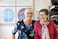 An image of two women smiling