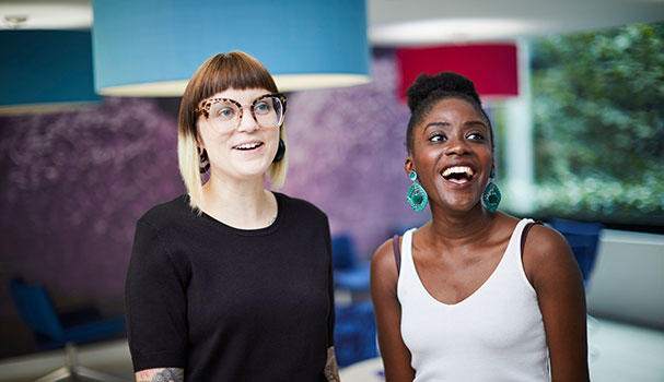 Two CRUK employees smiling