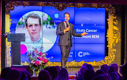 male speaker giving a talk on stage