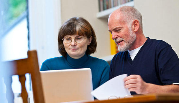 Couple looking at laptop
