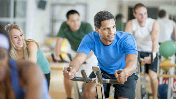 Male on exercise bike