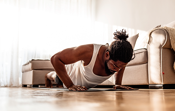 Photo of a man in the middle of doing push ups
