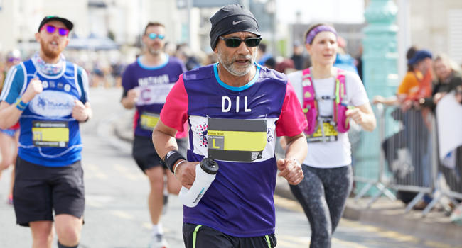 Man running in CRUK top