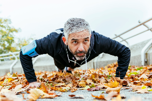 Man completing push-ups outdoors
