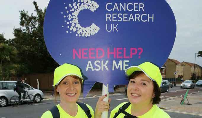 Volunteer at Shine Night Walk Two happy volunteers