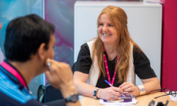 lady talking at desk