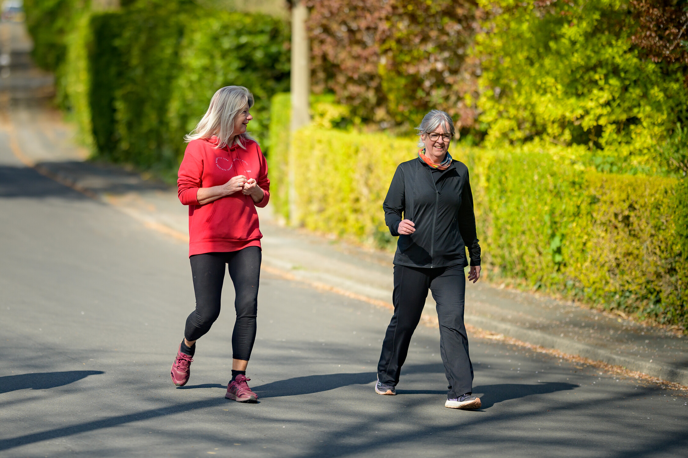 Smiling group walks along canal