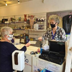 CRUK volunteer in shop