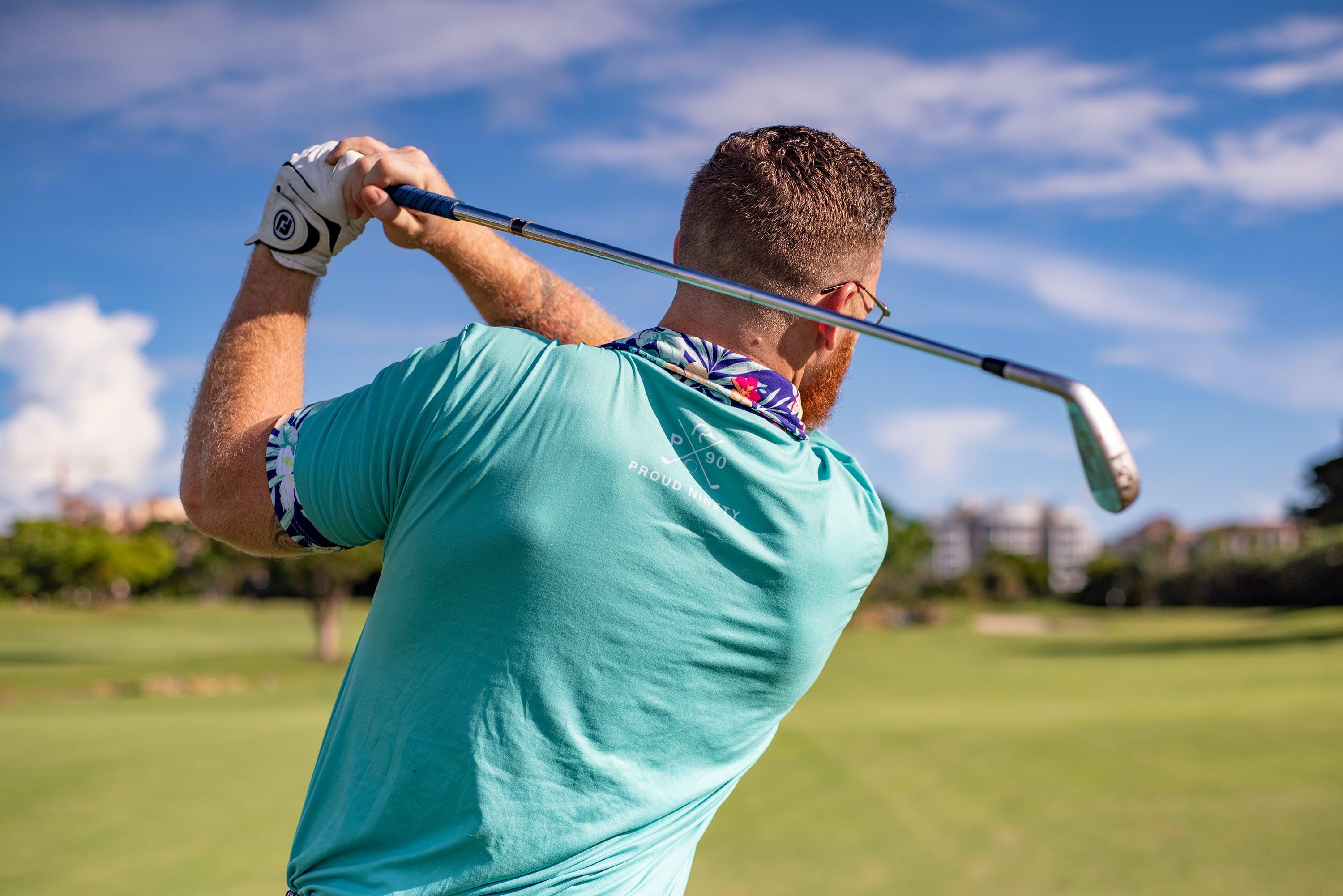 Man swinging a golf club