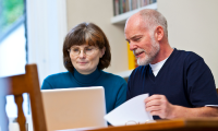 man and woman on computer