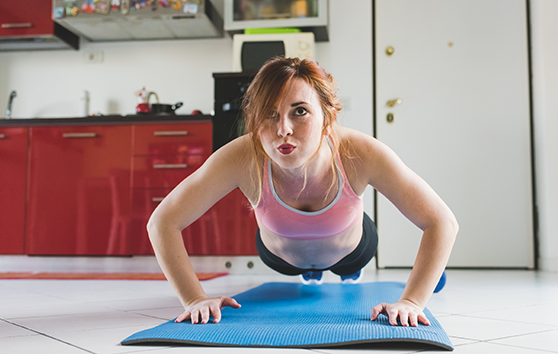 Photo of a women in the middle of a push up