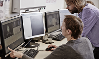 Researchers analyse results on a computer