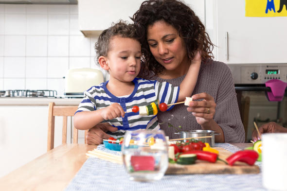 mother and child preparing food
