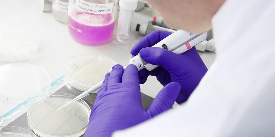 Scientist working with a pipette