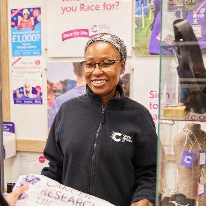 A volunteer assisting in a shop