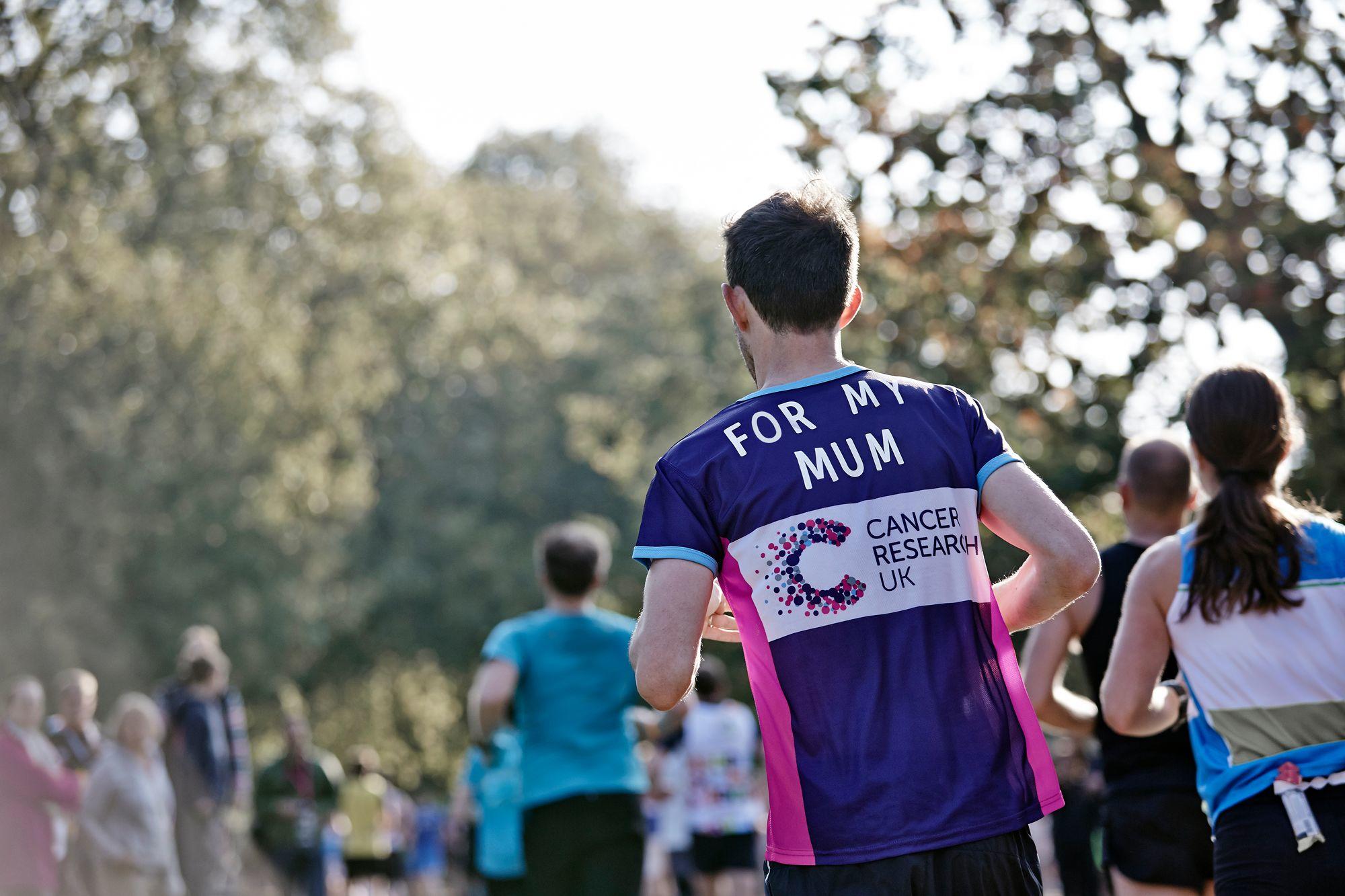 Runners all taking part in a race with Charity tops on