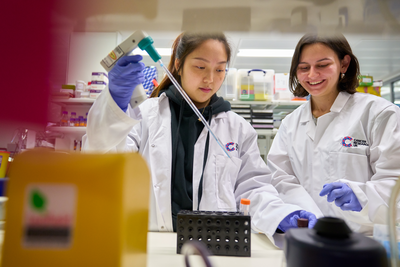 A photo of two researchers inside the lab