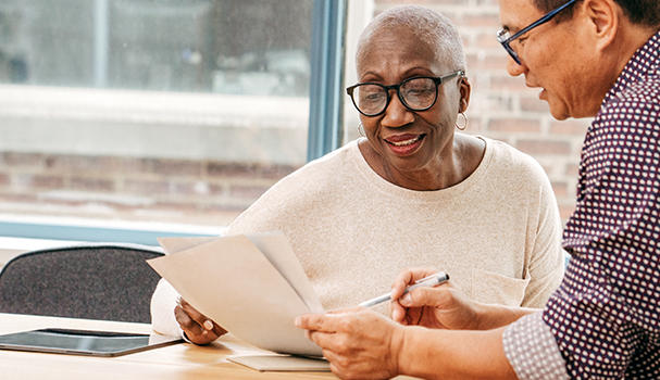 Solicitor and client looking at a document