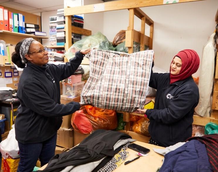 Volunteers in shop back room 