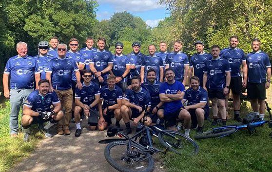 A photo of the South Wales Cancer Crusaders fundraising group at the end of their cycling challenge