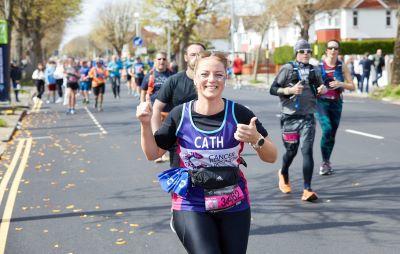 Get training support Smiling woman running race