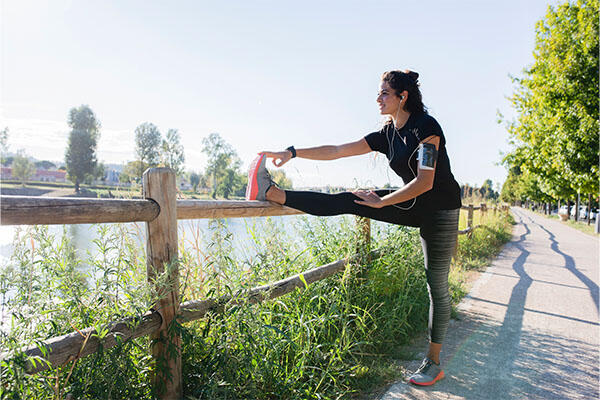 Woman stretching on a running path