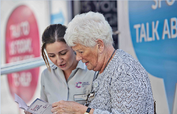 Nurse and lady talking through a health booklet Nurse and lady talking through a health booklet