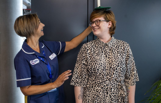 Cancer Awareness in the Workplace nurse measuring an employee attending a session 