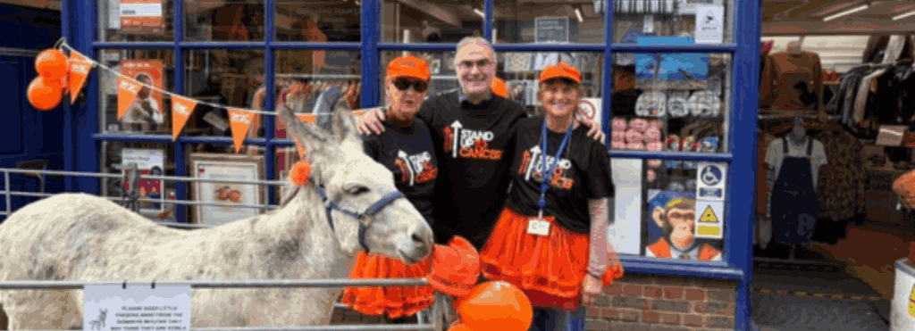 Shop volunteers standing outside the shop