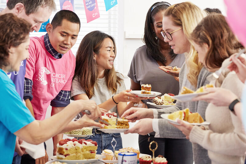 Volunteers fundraising at a bake sale
