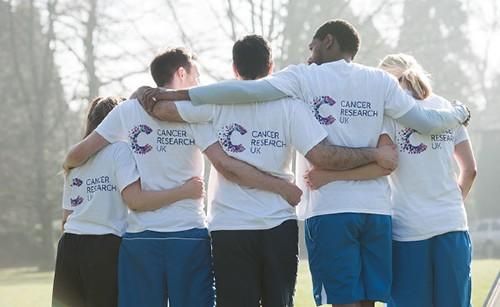 Cancer Research UK volunteers hugging each other