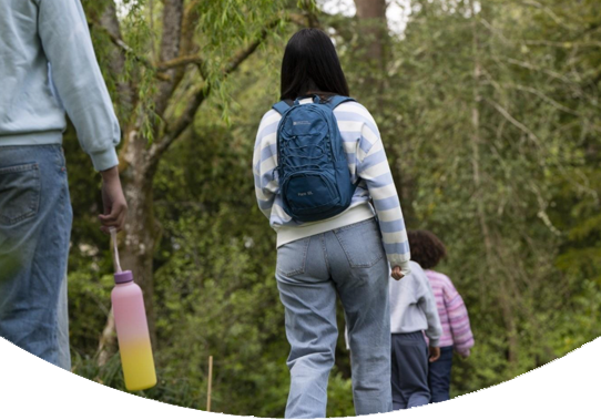 Two people walking in the woods