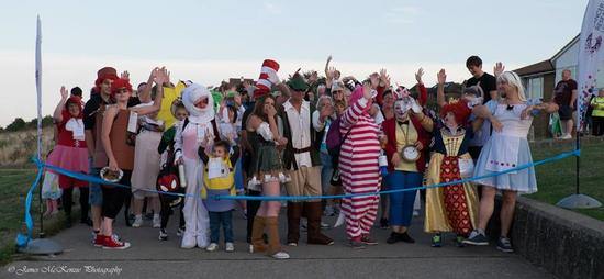 People in costumes at the Sunset Seaside Stroll 2023