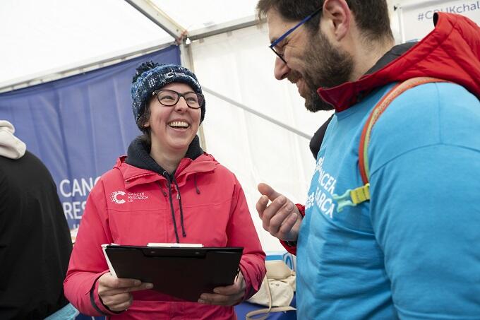 Volunteers smiling in the registration tent