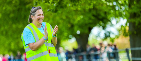 Event volunteers cheering on participants