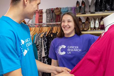 2 volunteers smiling
