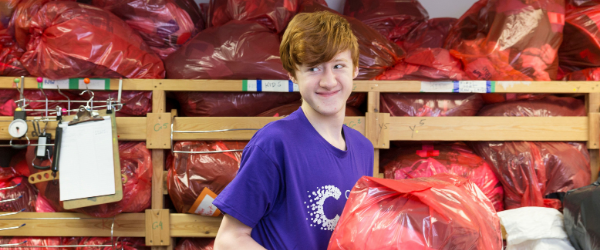 Young male stock processer volunteer