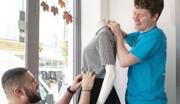 Volunteers making changes to shop window