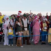 People in costumes at the Sunset Seaside Stroll 2023