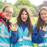 Volunteers cheering at event