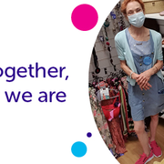 Two shop volunteers in masks socially distancing on the shop floor