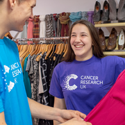 2 volunteers smiling 