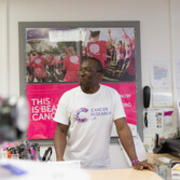 shop volunteer at the cashier looking out over shop